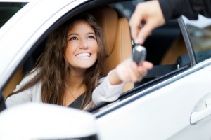 BLOG - girl handing keys to car